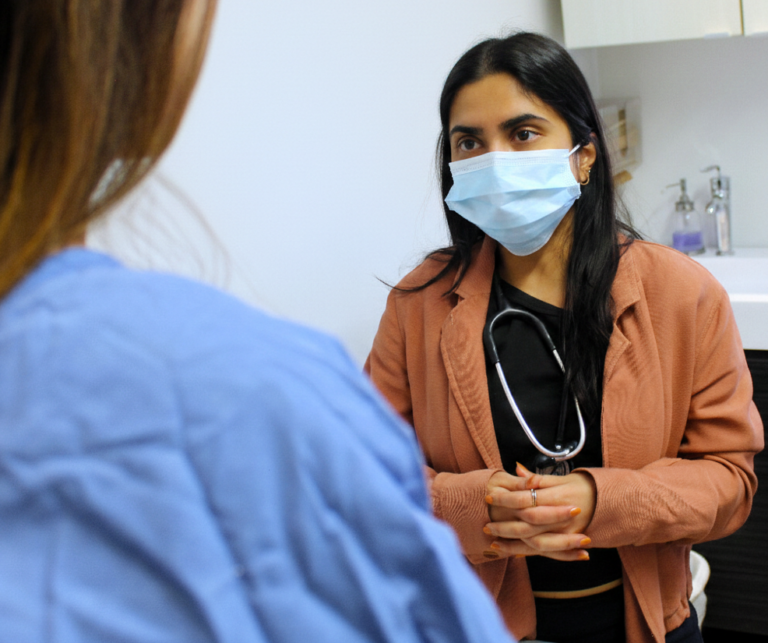 Nurse Practitioner is explaining to female patient
