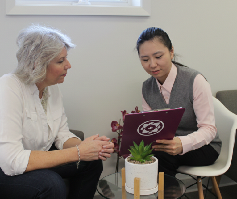 Psychotherapist counselling with patient